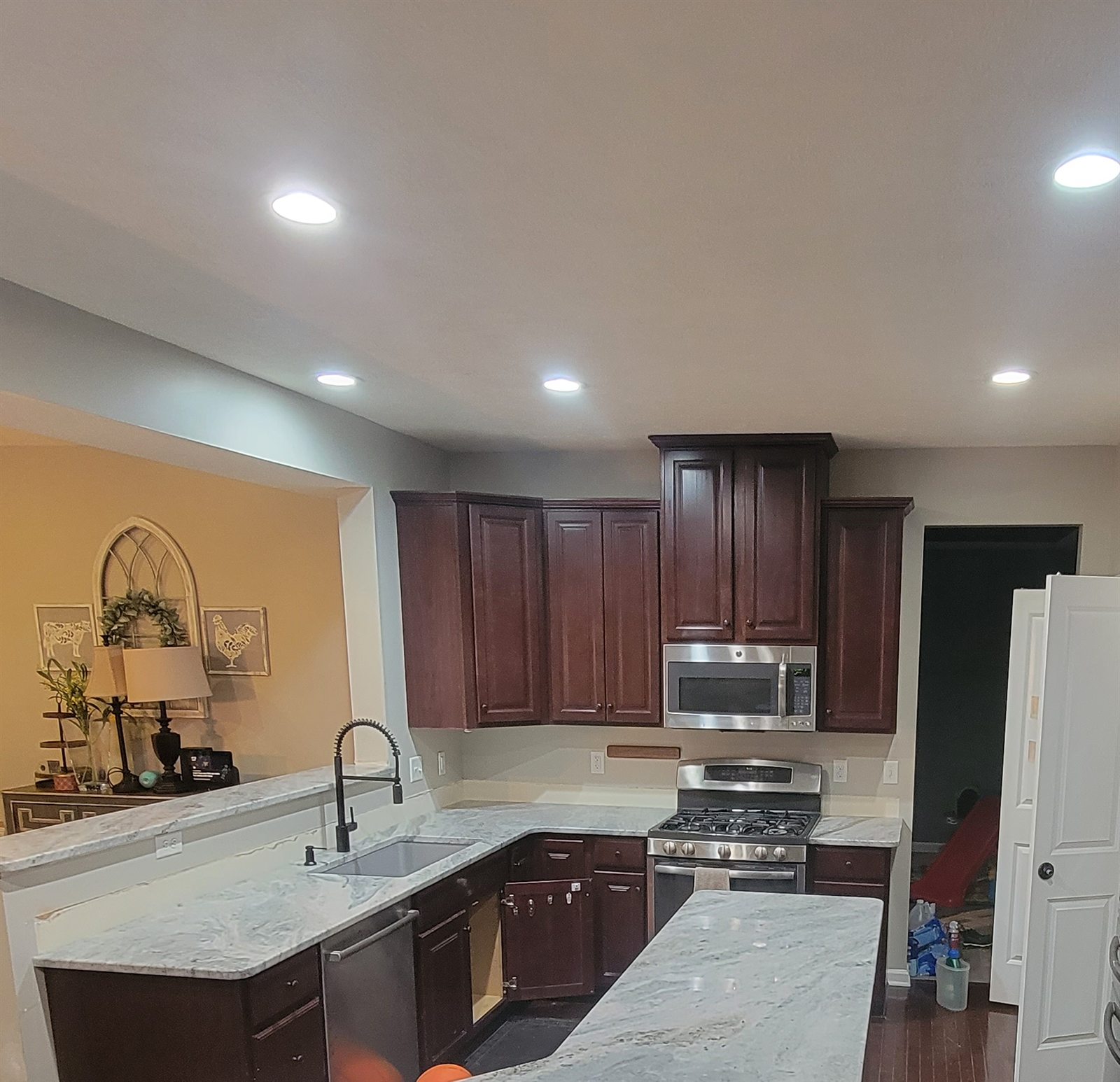 The Grove — kitchen with granite counters and dark cabinetry