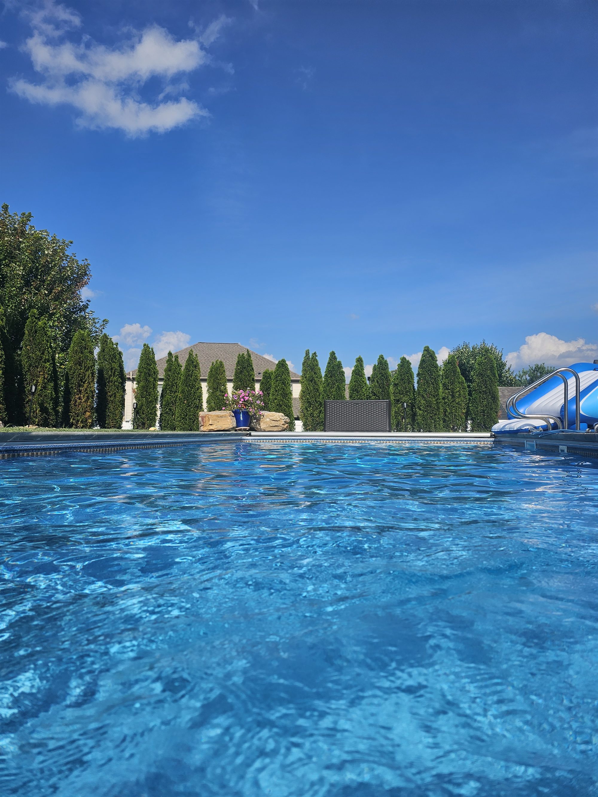 The Grove — clear pool water under blue sky